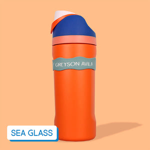 Orange and blue water bottle on a peach background, labeled with InchBug Orbit Labels® Personalized Water Bottle Label - Sea Glass