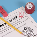 Red personalized teacher stamp with self-inking base, with a unique design featuring a teacher's name and a phrase 'Ay! Plus'.