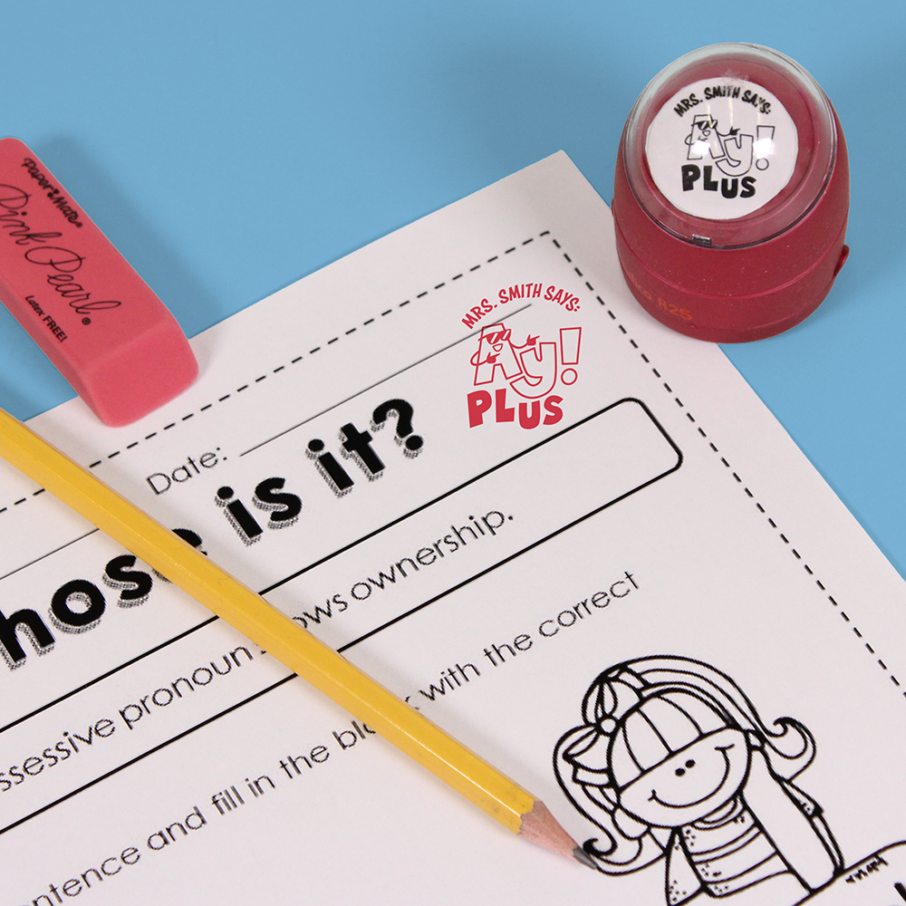 Red personalized teacher stamp with self-inking base, with a unique design featuring a teacher's name and a phrase 'Ay! Plus'.