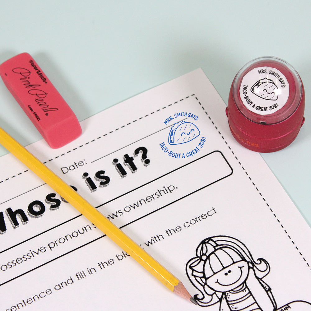Dark red personalized teacher stamp with self-inking base, with a unique design featuring a teacher's name and a phrase 'Taco-bout a great job!'.