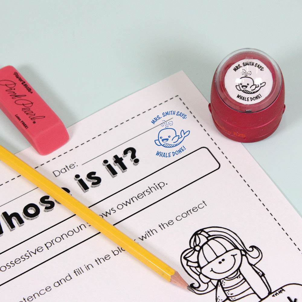 Dark red personalized teacher stamp with self-inking base, with a unique design featuring a teacher's name and a phrase 'Whale done!'.