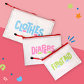 The InchBug 3-pack Diaper Bag Organizers placed on a red two-tone background, one marked 'CLOTHES', one 'DIAPERS', and one 'FIRST AID'.