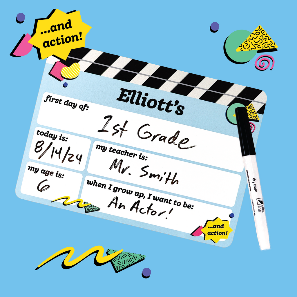 a personalized first day of school board with the name 'Elliott' written on it with doodles and shapes