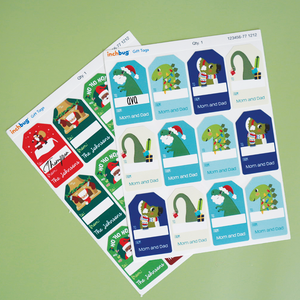 set of InchBug holiday gift tags product images against a green background