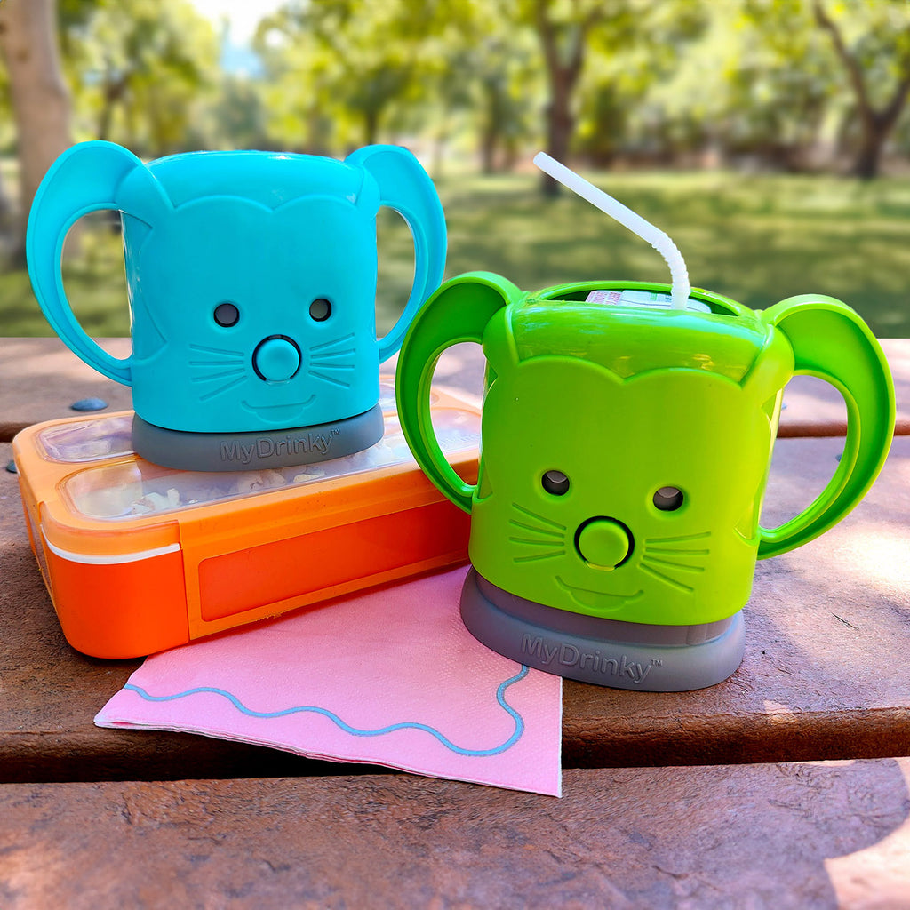 blue and green InchBug MyDrinky cups during a picnic
