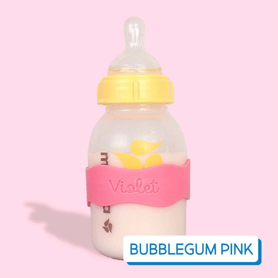 Baby bottle with pink InchBug Orbit Label on a pink background, labeled 'Bubblegum Pink'.