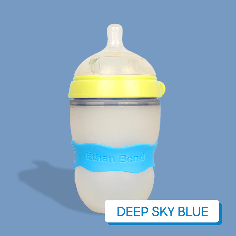 Baby bottle with deep sky blue InchBug Orbit Label on a deep sky blue background, labeled 'Deep Sky Blue'.