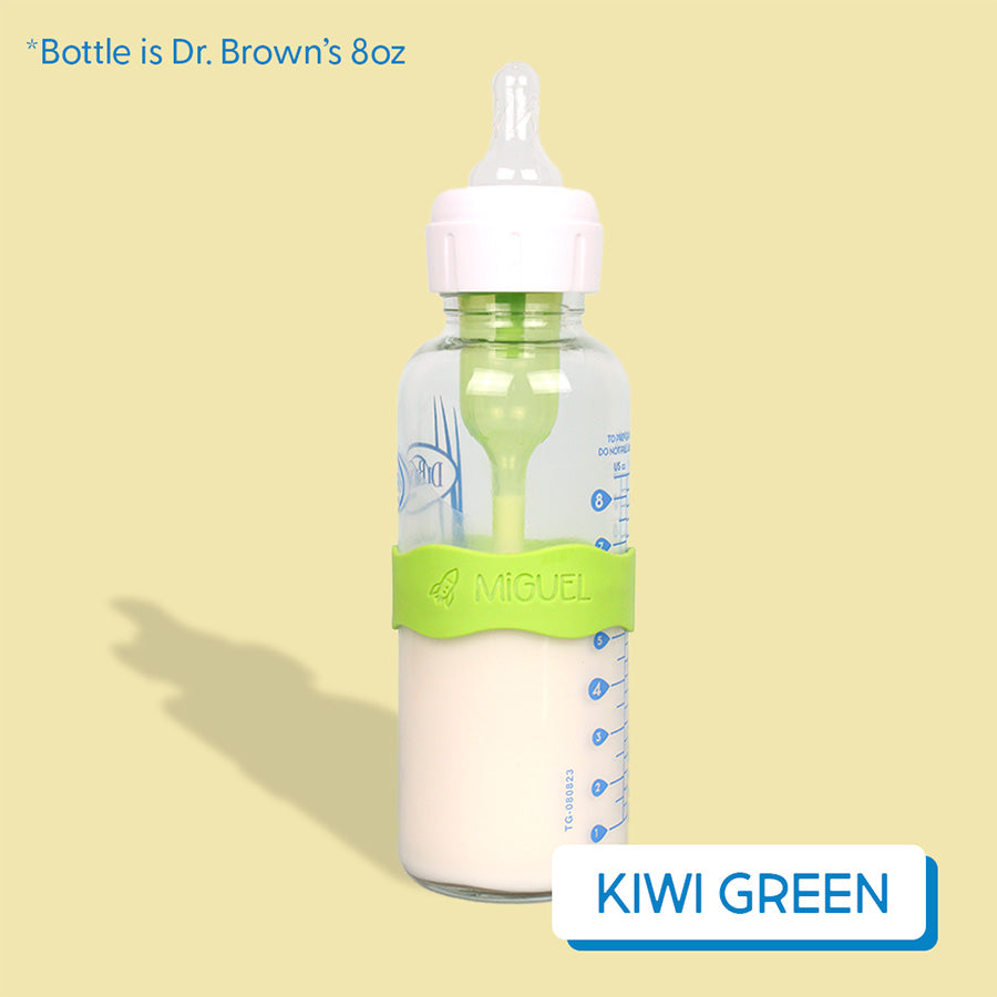 Baby bottle with light green InchBug Orbit Label on a yellow background, labeled 'Kiwi Green'.