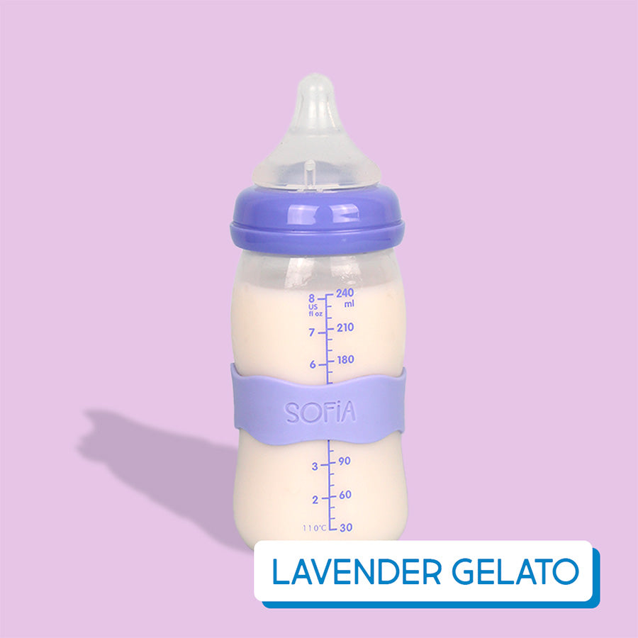 Baby bottle with lavender InchBug Orbit Label on a pink background, labeled 'Lavender Gelato'.