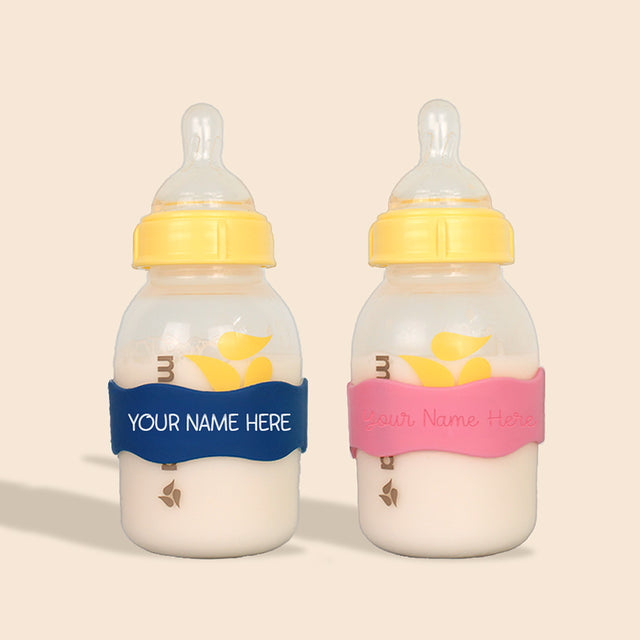 Two baby bottles with InchBug Orbit Labels