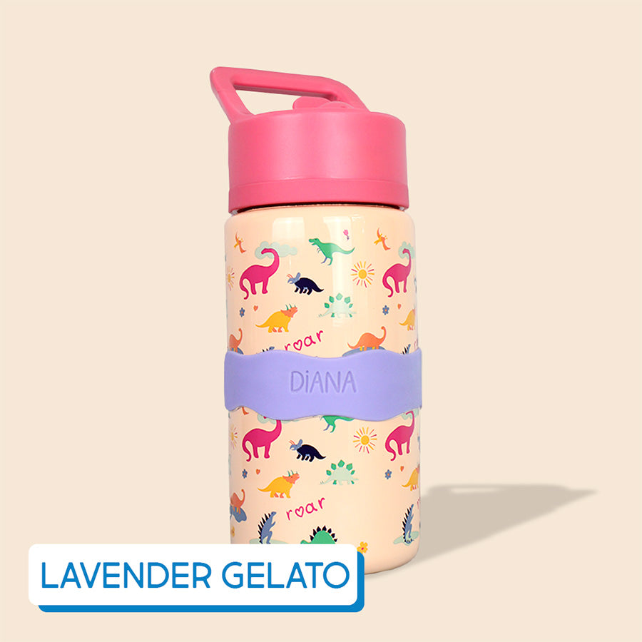 Children's water bottle with cartoonish dinosaur pattern and pink lid on a beige background, labeled with InchBug Orbit Labels® Personalized Water Bottle Label - Lavender Gelato