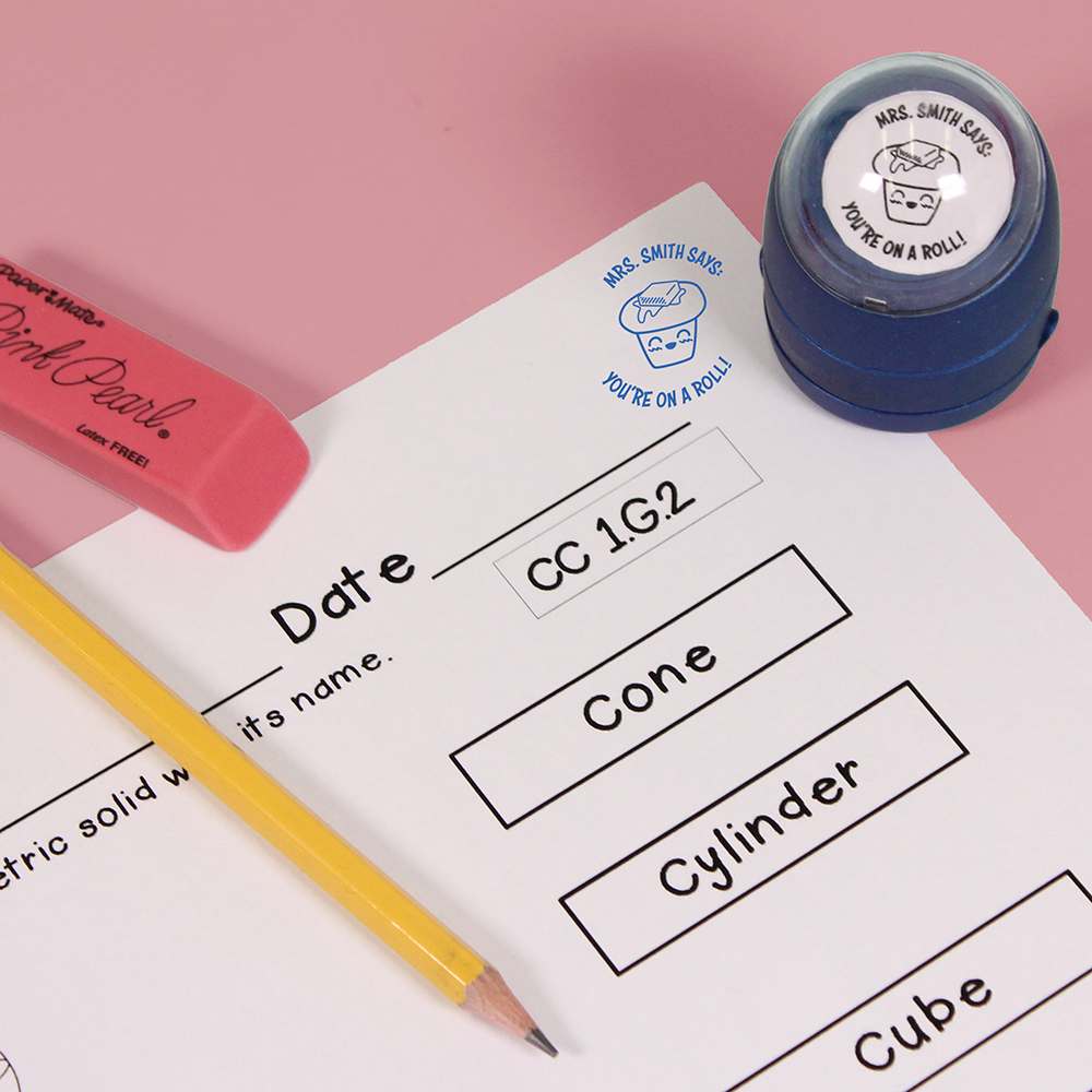 Blue personalized teacher stamp with self-inking base, with a unique design featuring a teacher's name and a phrase 'You're on a roll!'.
