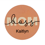 A personalized coaster with the text 'mom' and a custom name 'Kaitlyn' printed on it.
