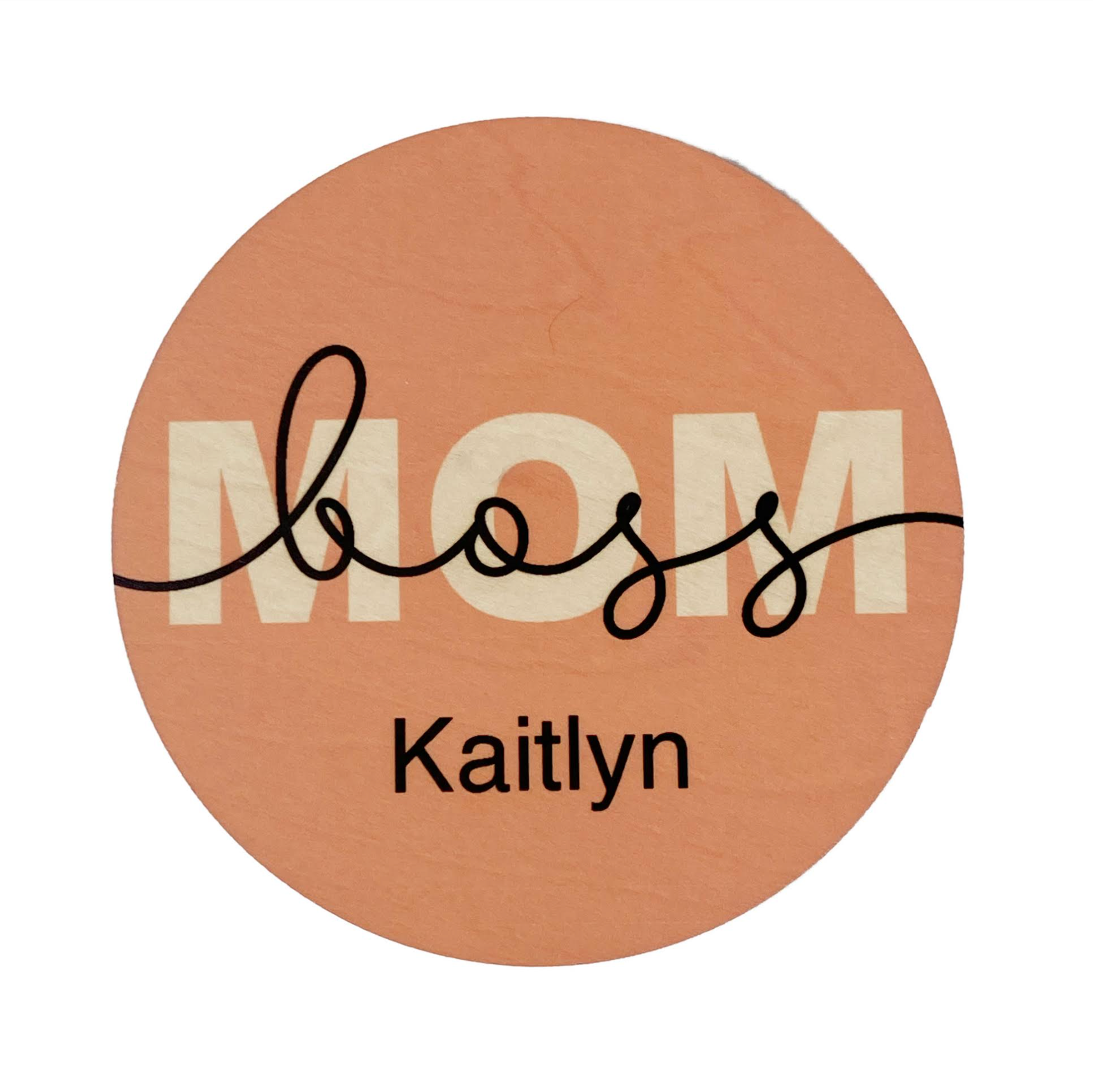 A personalized coaster with the text 'mom' and a custom name 'Kaitlyn' printed on it.