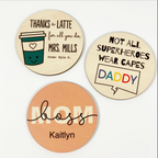 3 personalized coasters with different text: Thanks a Latte, Not All Superheroes Wear Capes, Boss Mom