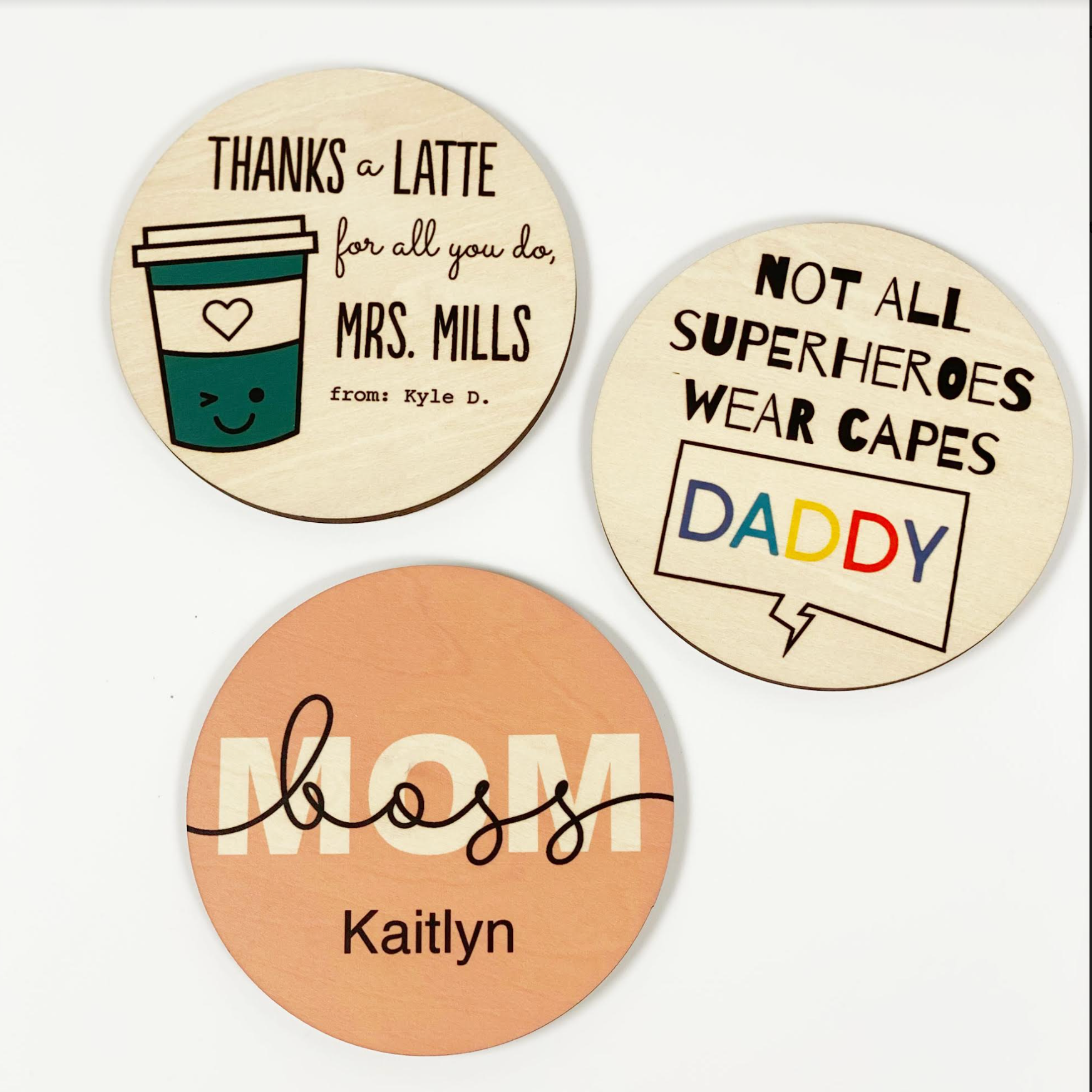 3 personalized coasters with different text: Thanks a Latte, Not All Superheroes Wear Capes, Boss Mom