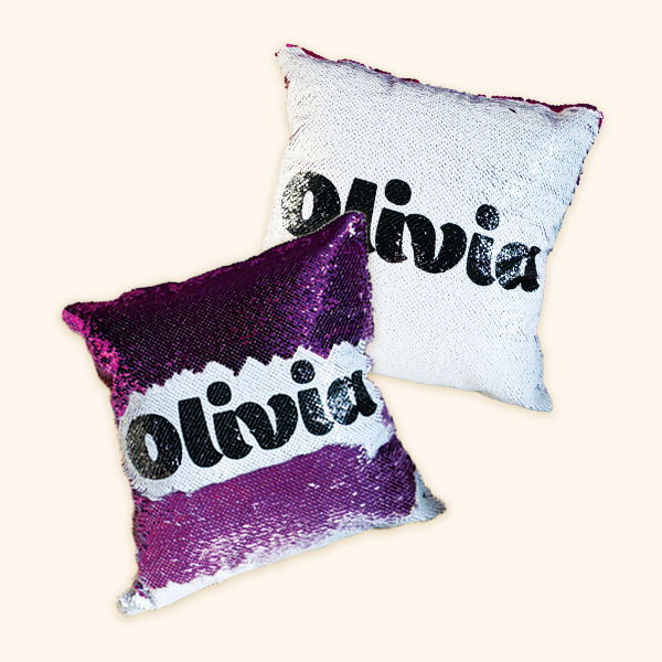 reversible sequin pillowcases with the name 'Olivia' printed on it, showing the name on both a purple and white sequin surface
