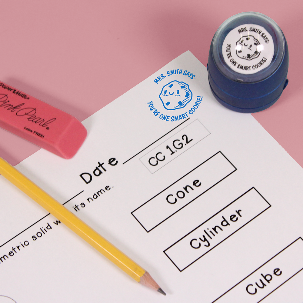 Blue personalized teacher stamp with self-inking base, with a unique design featuring a teacher's name and a phrase 'You're one smart cookie!'.