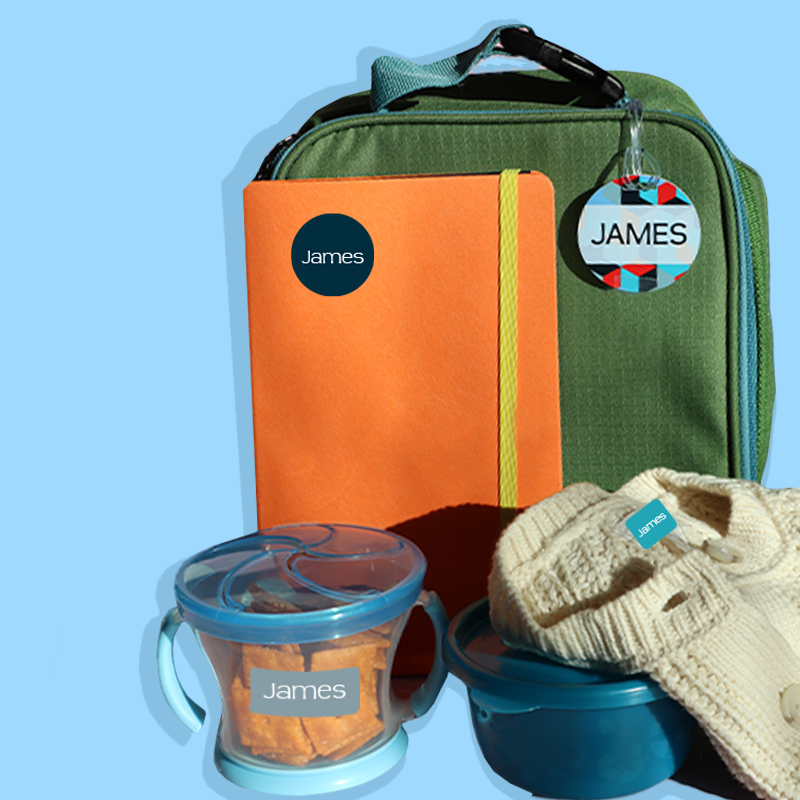 food containers, notebooks, clothes, and bag labeled with InchBug personalized name labels