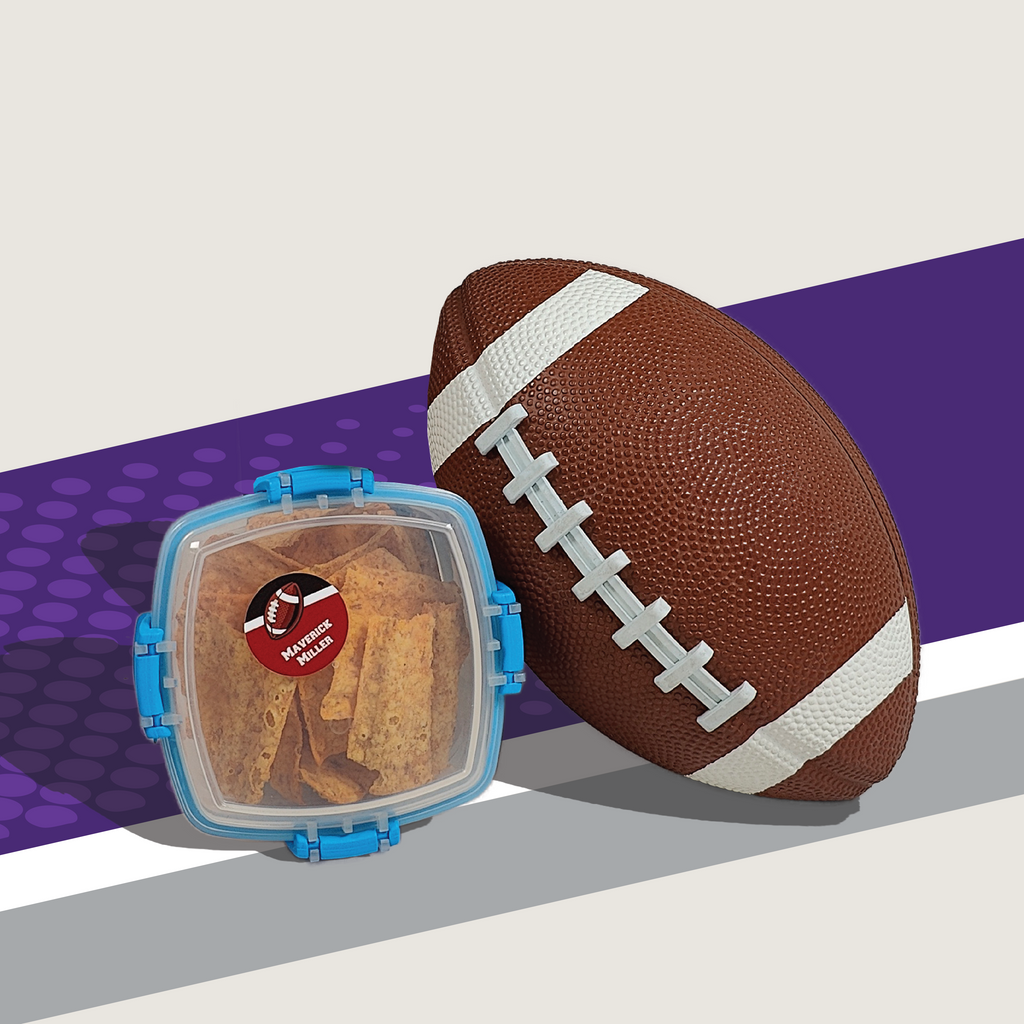food container labeled with InchBug custom labels for kids in sports beside American football