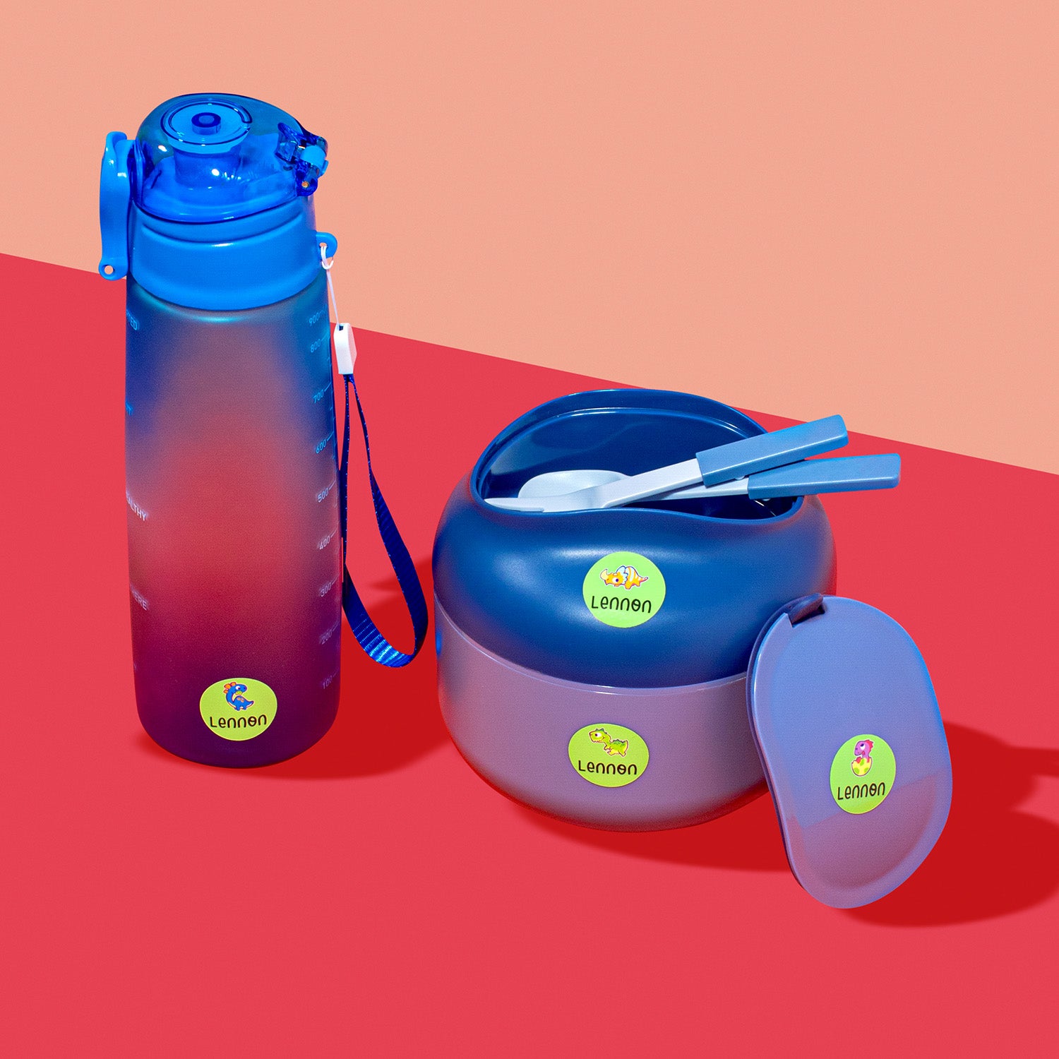 Green InchBug sticker name labels displayed on a water bottle and a lunch box.