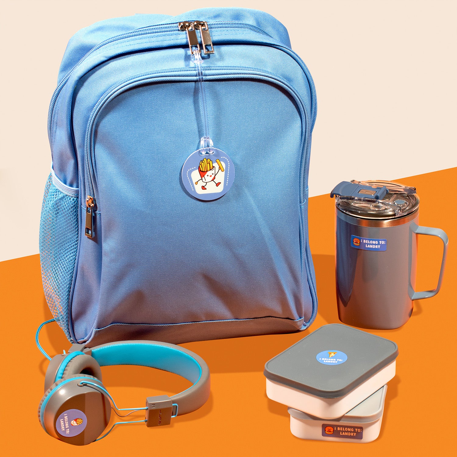 a blue backpack, an insulated cup, headphones, and food containers, each labeled with blue InchBug labels and bag tags