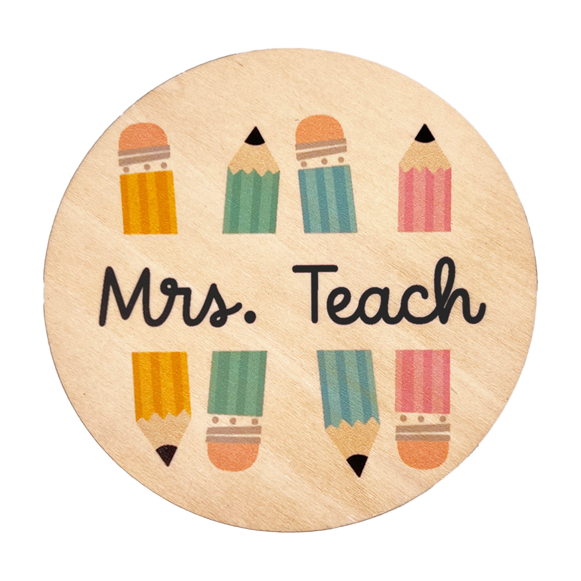 A round wooden coaster with the text 'Mrs. Teach' and colorful pencil illustrations.