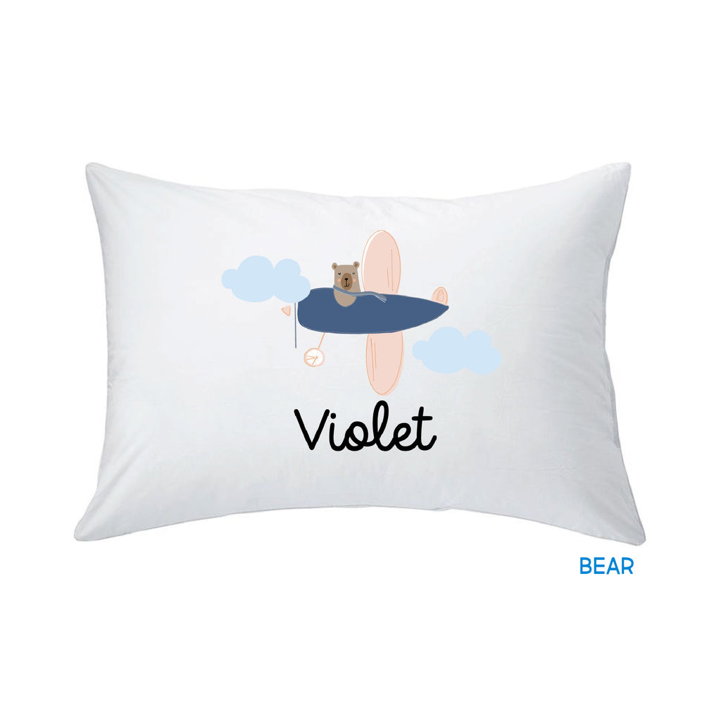 white pillow with bear print design against a white background, customized by InchBug with the name "Violet"; small text in blue reads "BEAR"