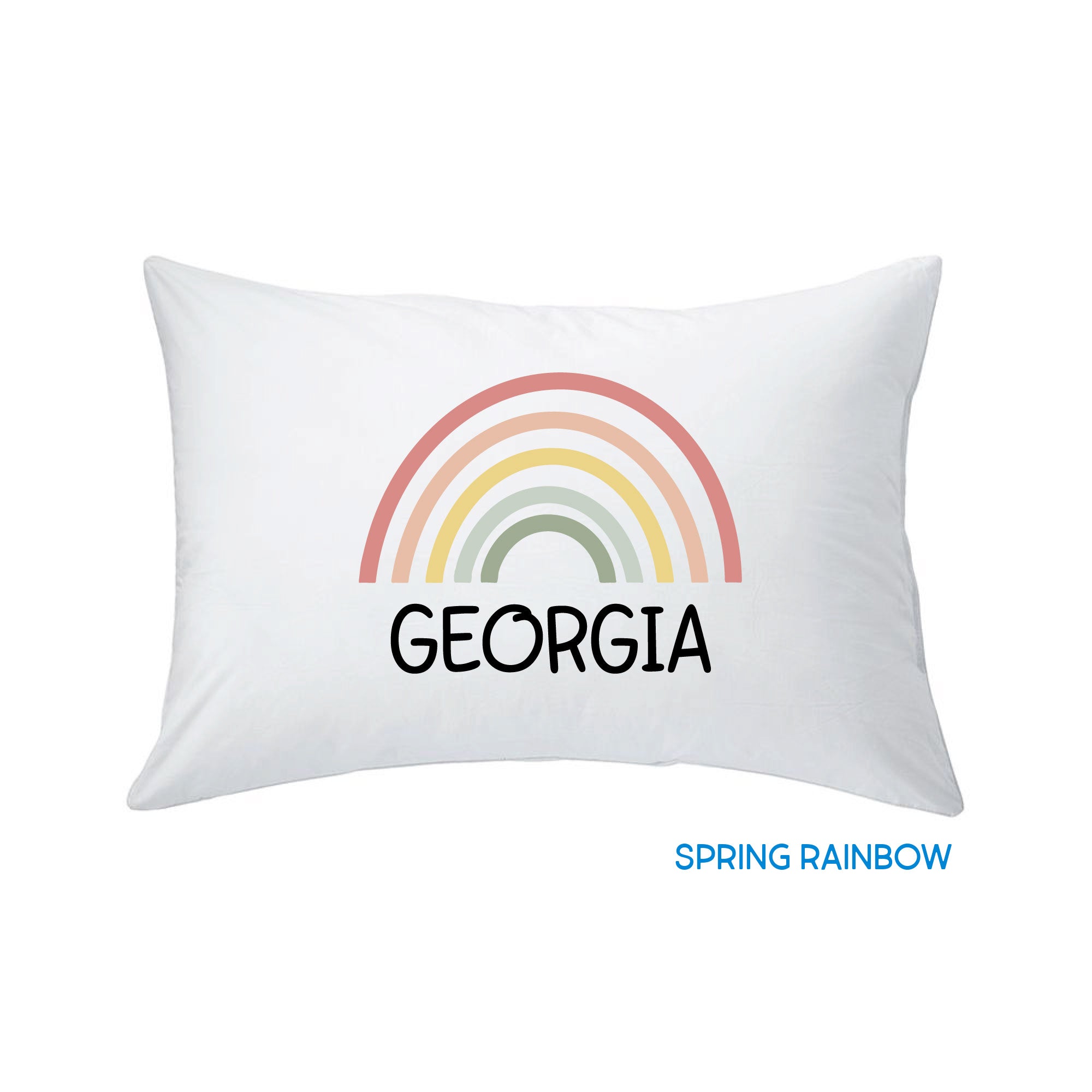 white pillow with rainbow print design against a white background, customized by InchBug with the name "Georgia"; small text in blue reads "SPRING RAINBOW"