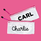 2 pink InchBug zipper pouches with different fonts