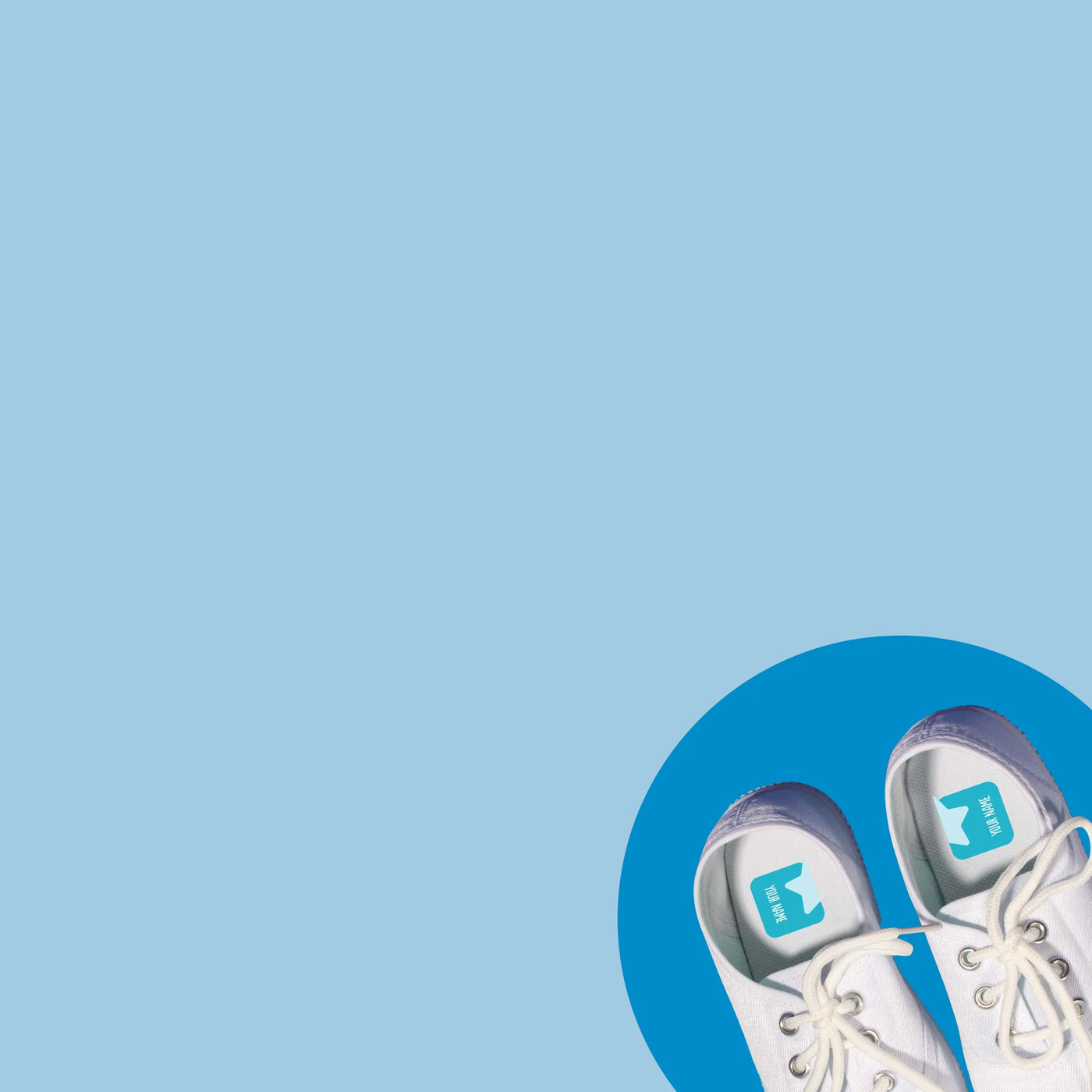 A pair of white shoes with a single orange InchBug ShoePal label attached to one side, displayed against a blue background.