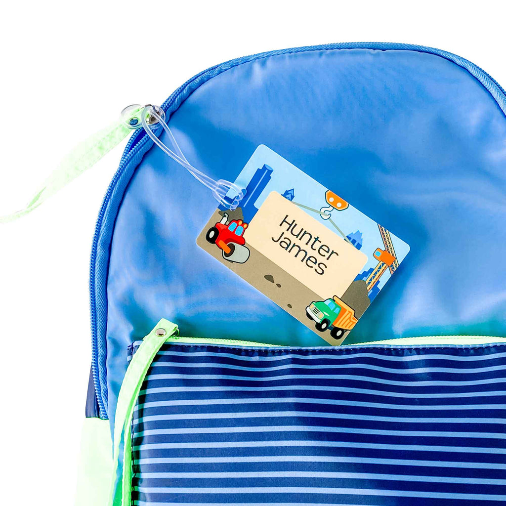 a blue backpack labeled with an InchBug children's bag tag