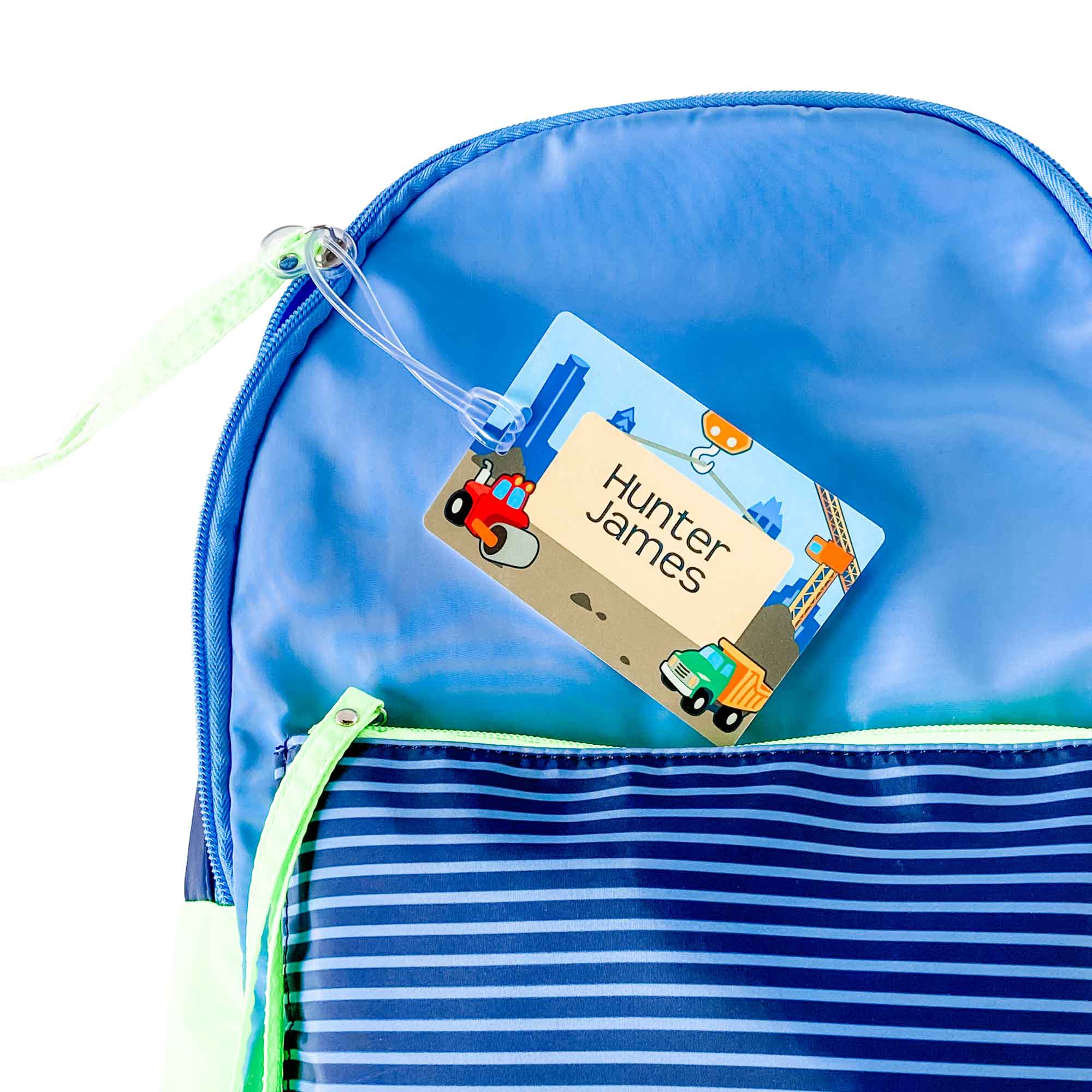 a blue backpack labeled with an InchBug children's bag tag