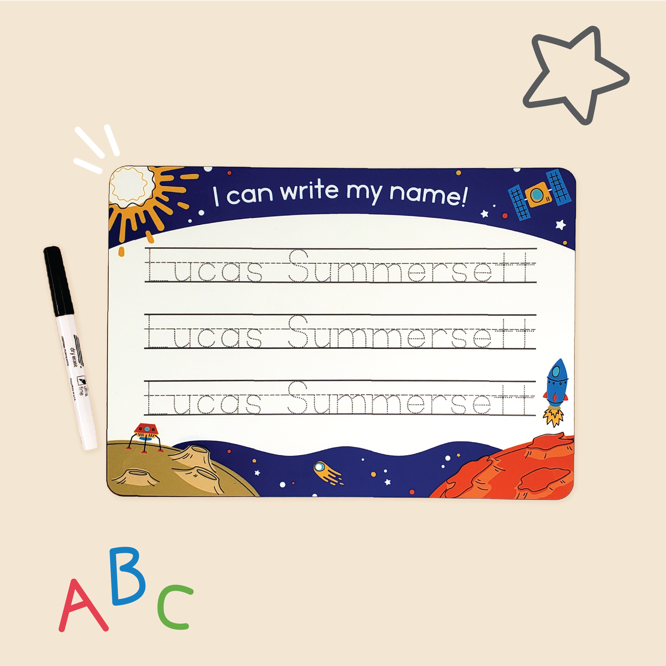To The Moon design of InchBug personalized handwriting board, featuring satellites, rockets, and the surface of asteroids; there are doodles around it and a marker pen is beside it