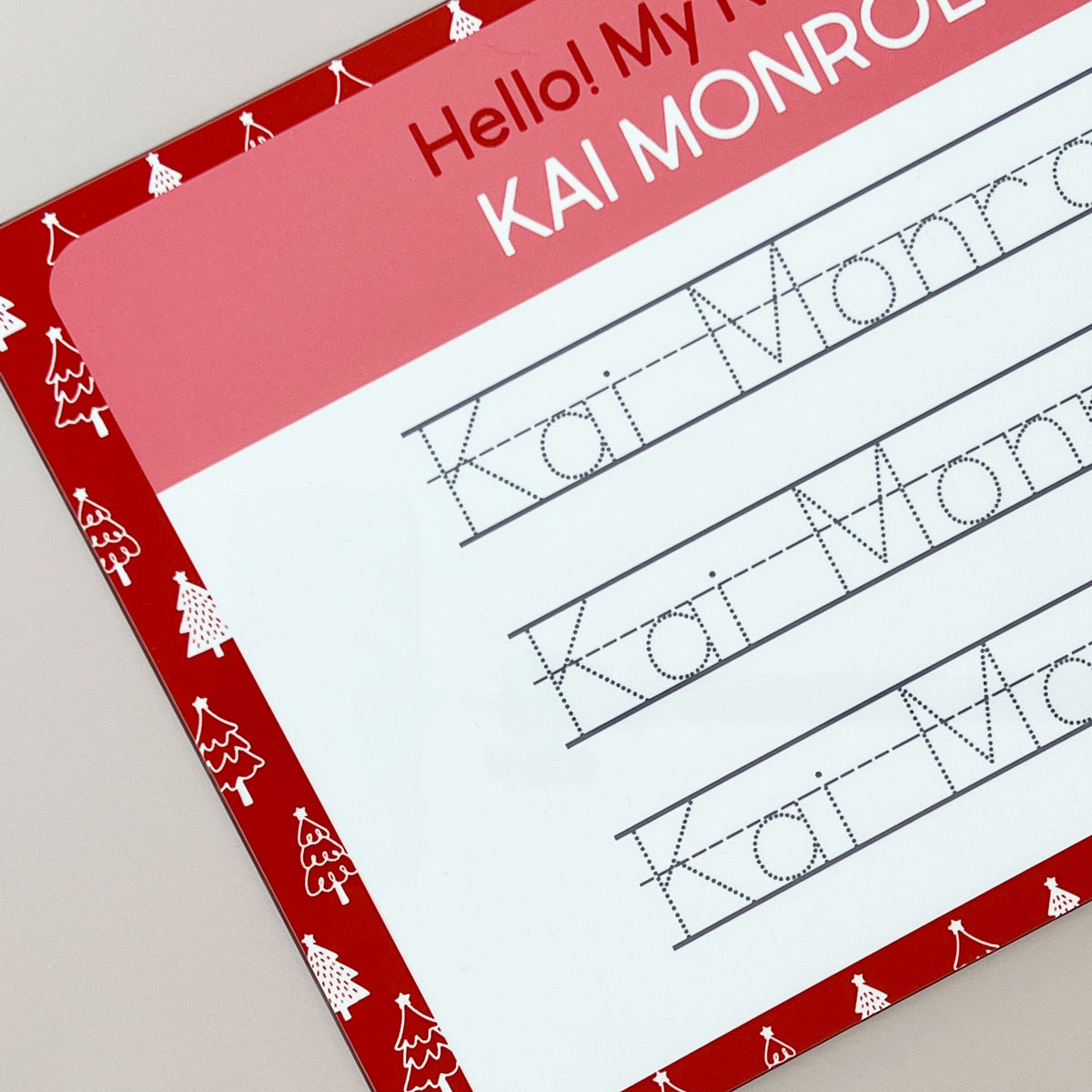 close-up view of the InchBug personalized handwriting board with Christmas tree designs