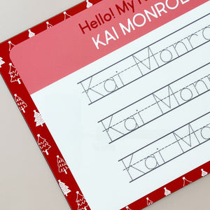 close-up view of the InchBug personalized handwriting board with Christmas tree designs