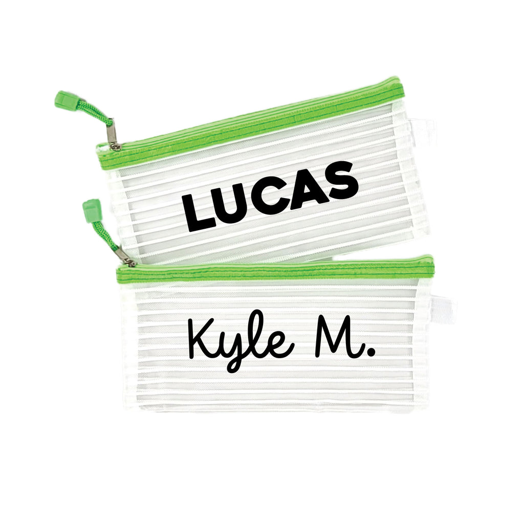 Two green InchBug personalized zipper pouches with the names 'LUCAS' and 'Kyle M.' printed on them.