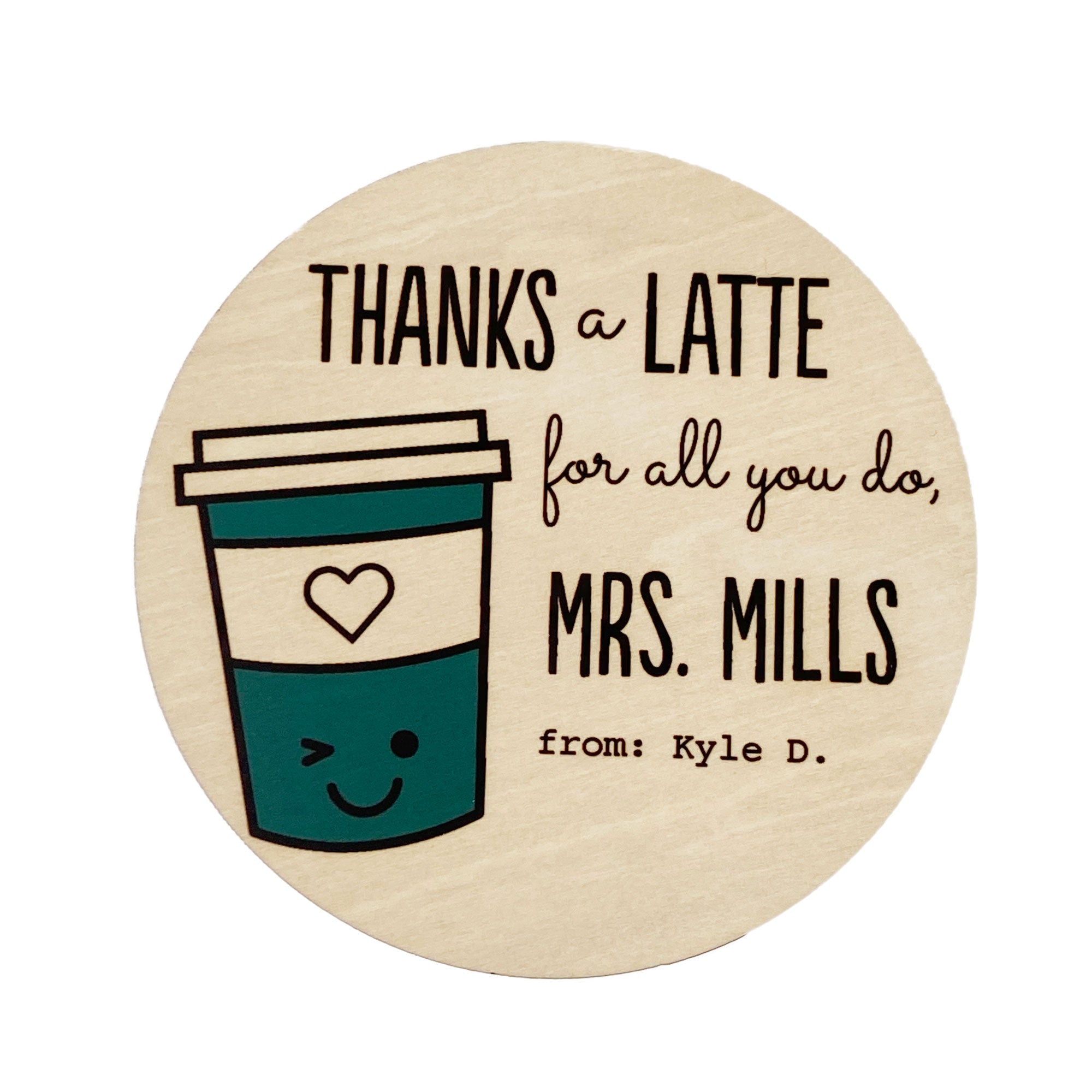A personalized coaster with the text 'THANKS a LATTE for all you do, MRS. MILLS' and a space for a custom name, depicting a cartoon coffee cup with a heart and a smiley face.