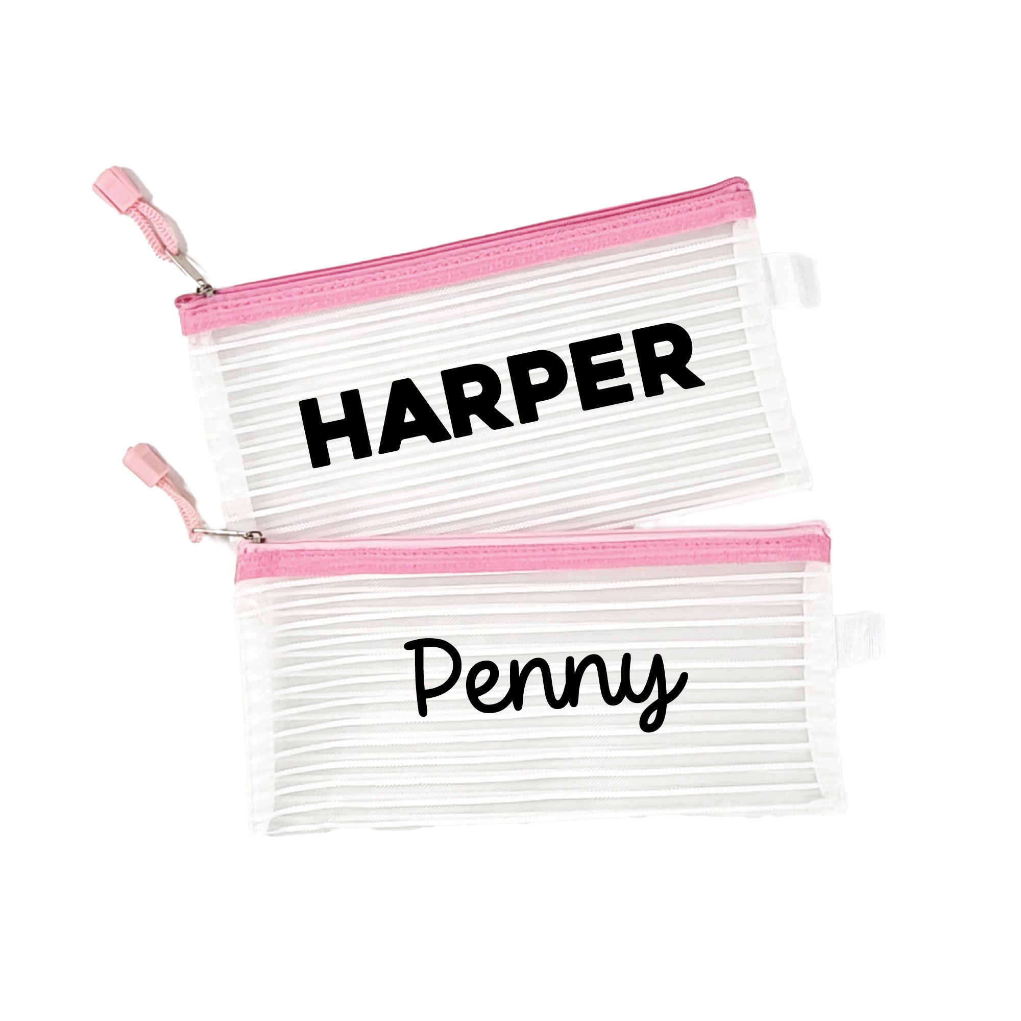 Two pink InchBug personalized zipper pouches with the names 'HARPER' and 'Penny' printed on them.