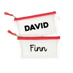 Two red InchBug personalized zipper pouches with the names 'DAVID' and 'Finn' printed on them.