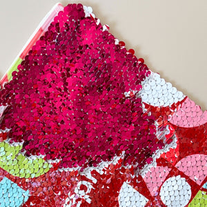 close-up view of the InchBug sequin pouch