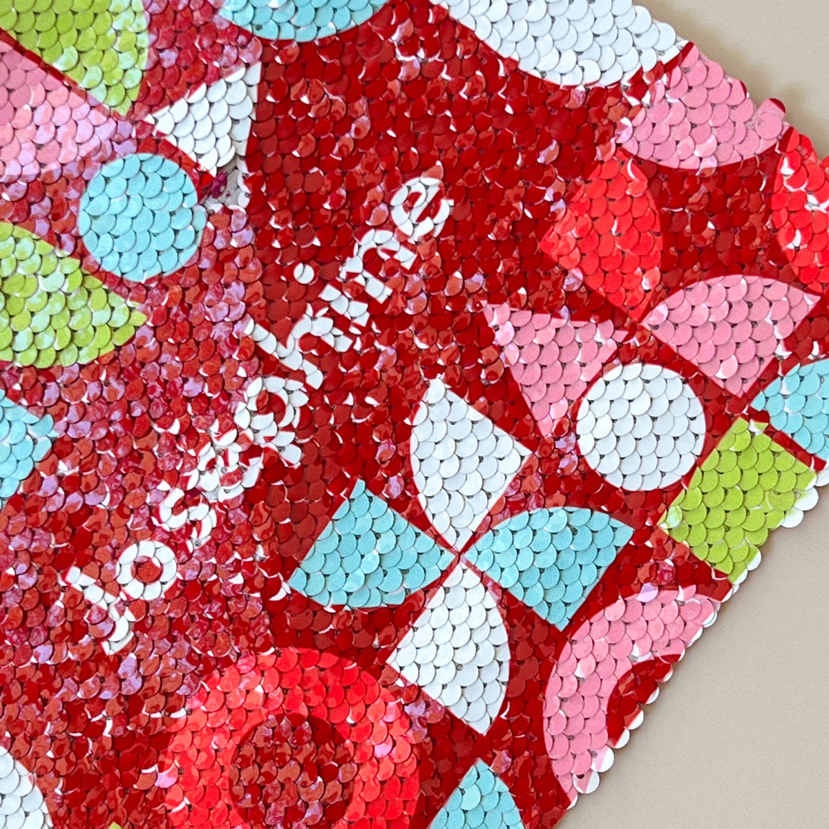 patterns of the InchBug sequin pouch more closely seen